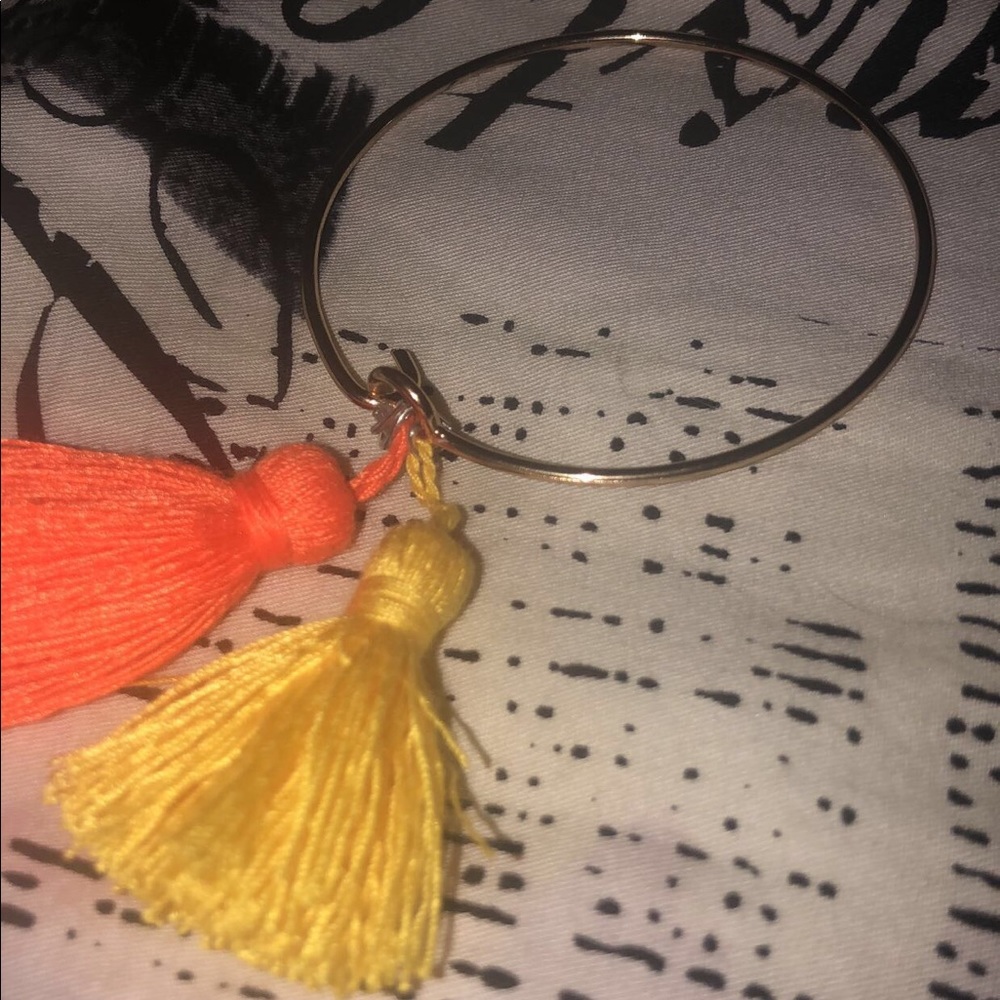 gold bangle with tassel